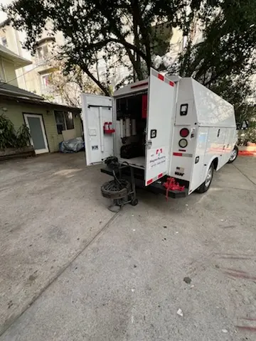 Magnet Plumbing service vehicle on-site for Grease Trap Cleaning in Lakeland Village